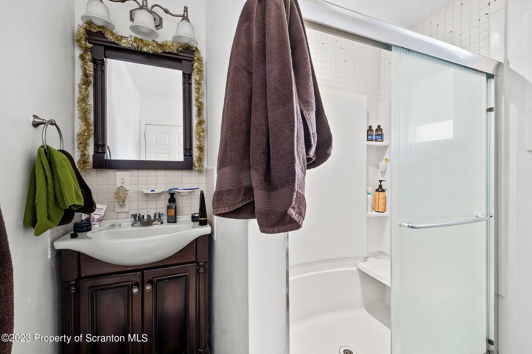 1023 Mark Avenue Scranton, PA 18510 - Photo 20 of 23 a bathroom with a sink vanity and a mirror