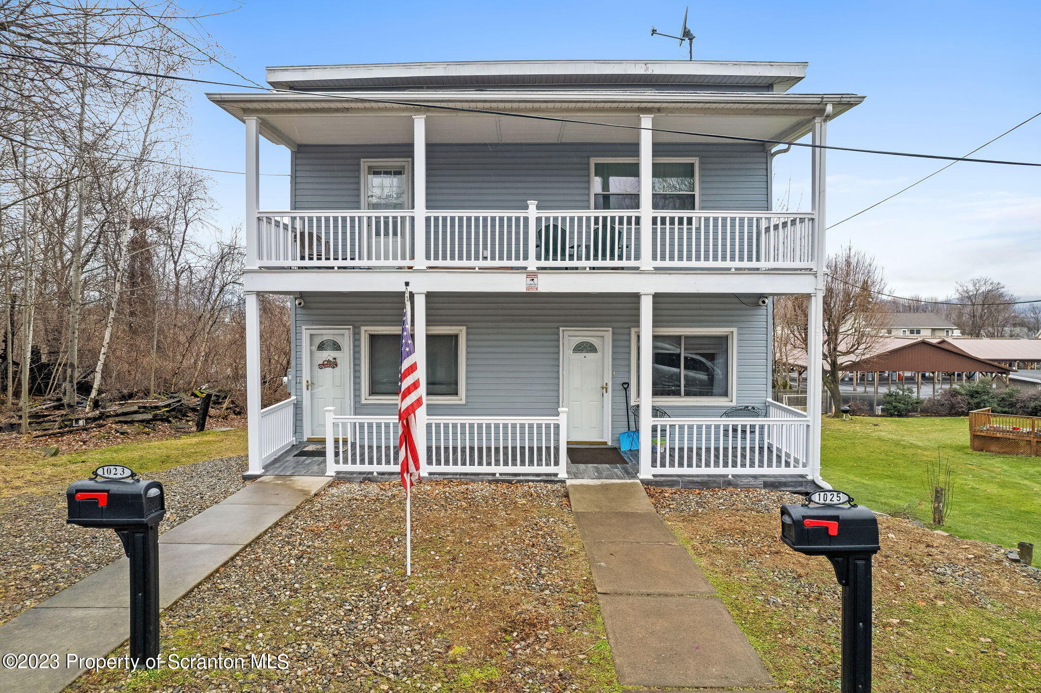 1023 Mark Avenue Scranton, PA 18510 - Photo 22 of 23 a front view of a house with garden