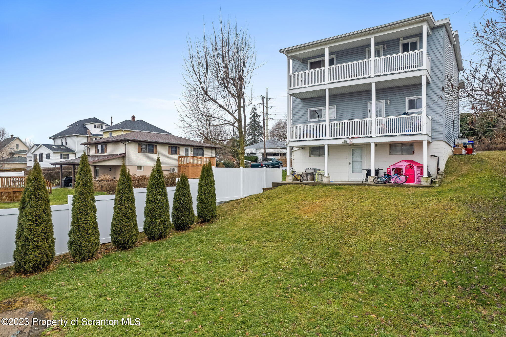 1023 Mark Avenue Scranton, PA 18510 - Photo 3 of 23 a view of a large pool with lawn chairs and a yard