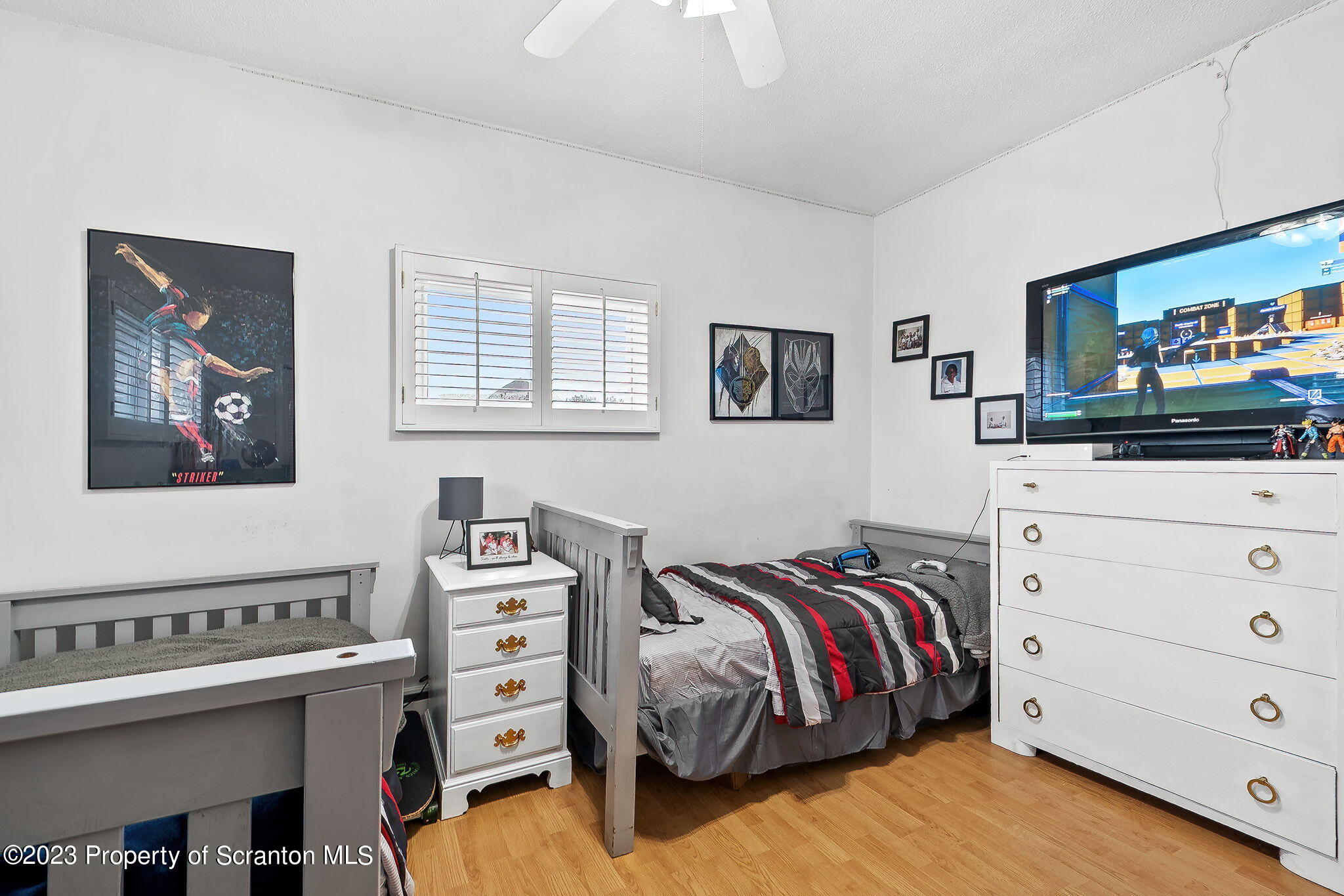 1023 Mark Avenue Scranton, PA 18510 - Photo 9 of 23 a bedroom with a bed and a flat screen tv