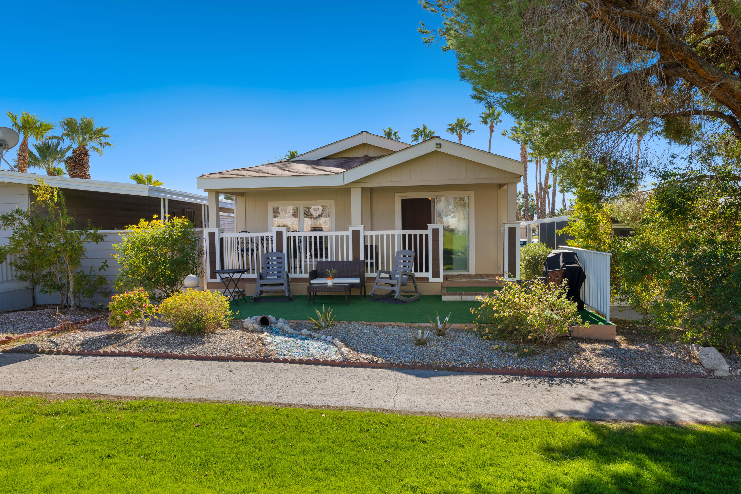 a view of a house with a yard and a garden