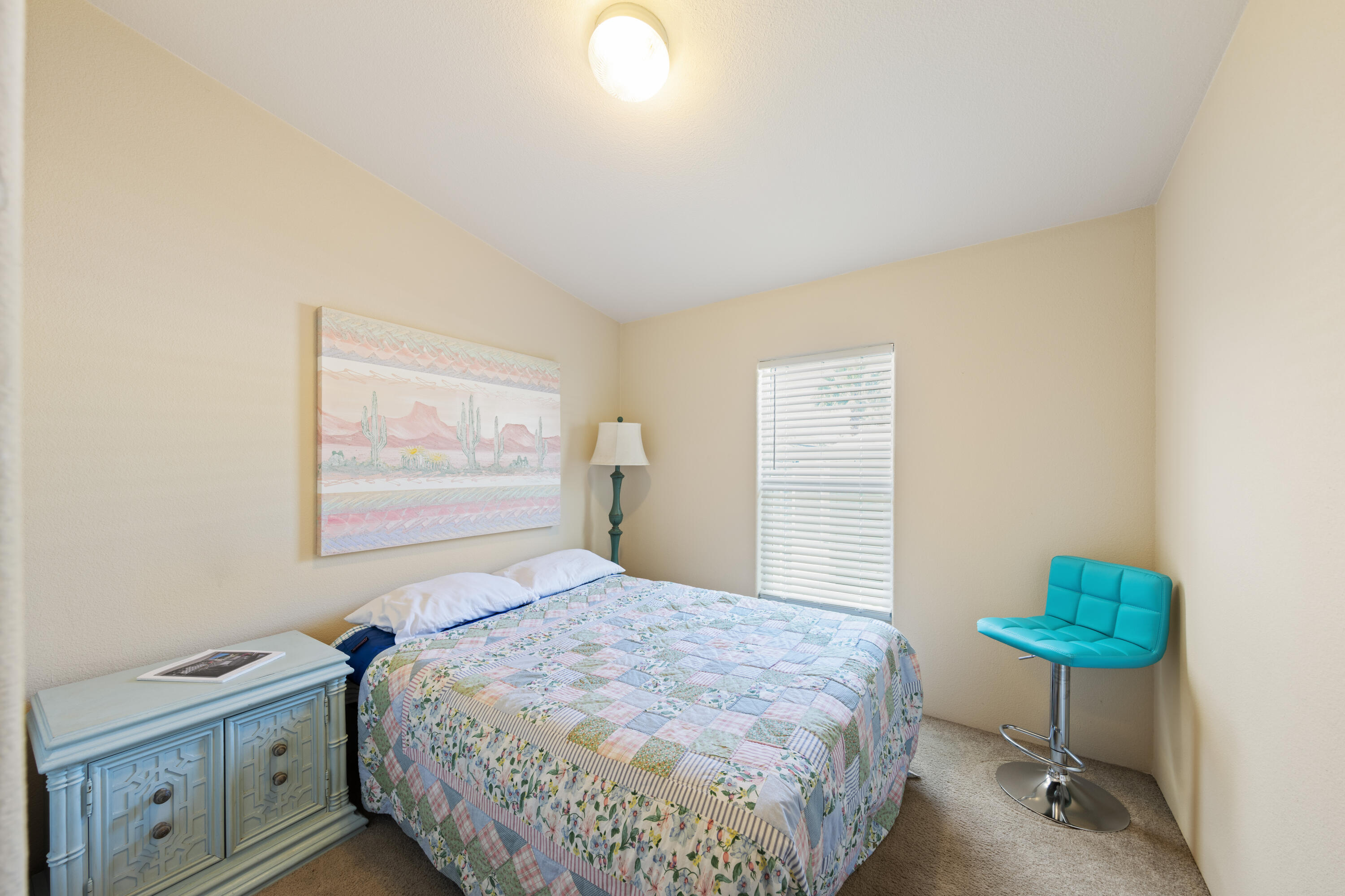 15500 Bubbling Wells Road, Unit 243 Desert Hot Springs, CA 92240 - Photo 15 of 39 a bedroom with a bed and a table in it