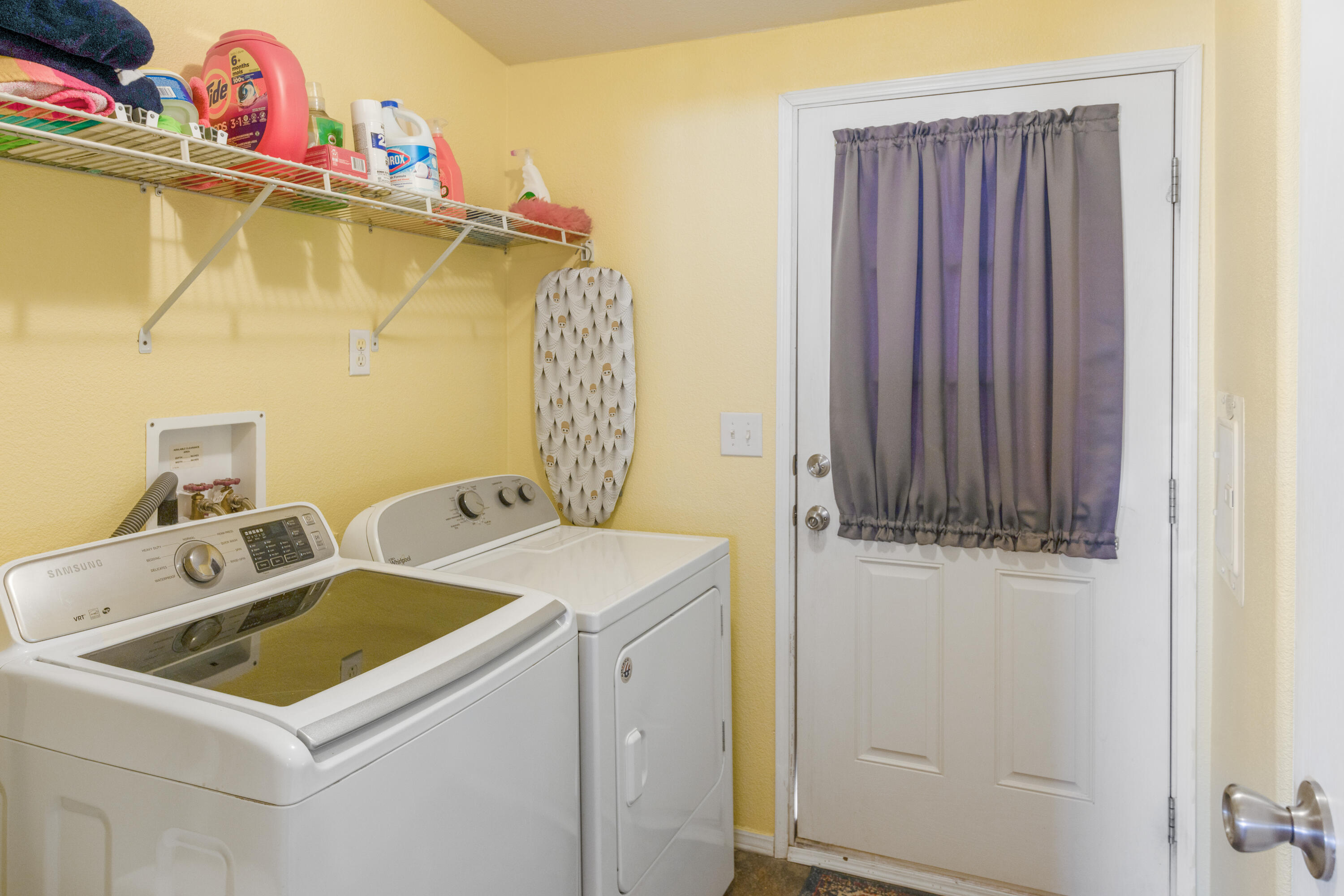 15500 Bubbling Wells Road, Unit 243 Desert Hot Springs, CA 92240 - Photo 17 of 39 a utility room with dryer and washer