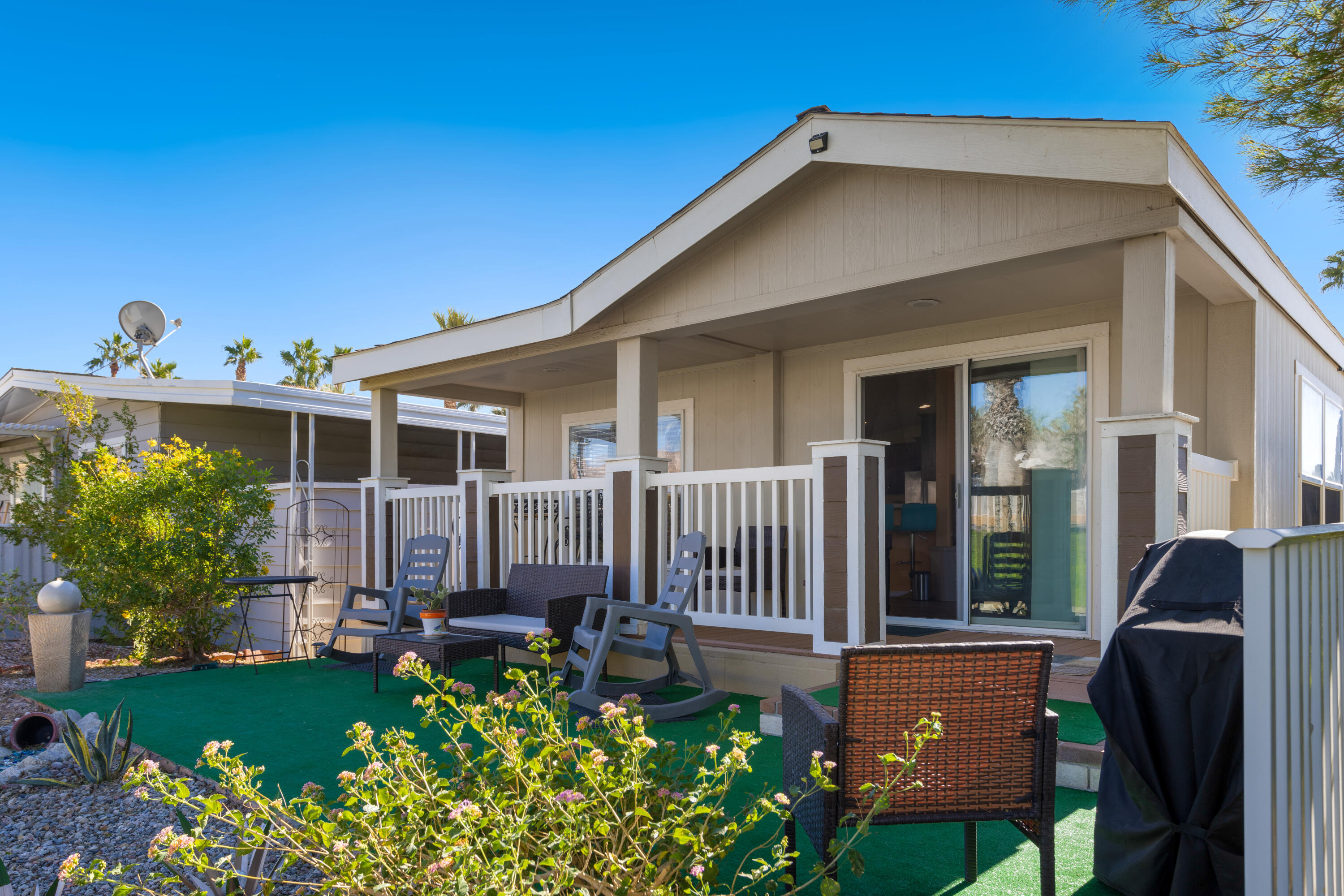 15500 Bubbling Wells Road, Unit 243 Desert Hot Springs, CA 92240 - Photo 2 of 39 a front view of a house with garden