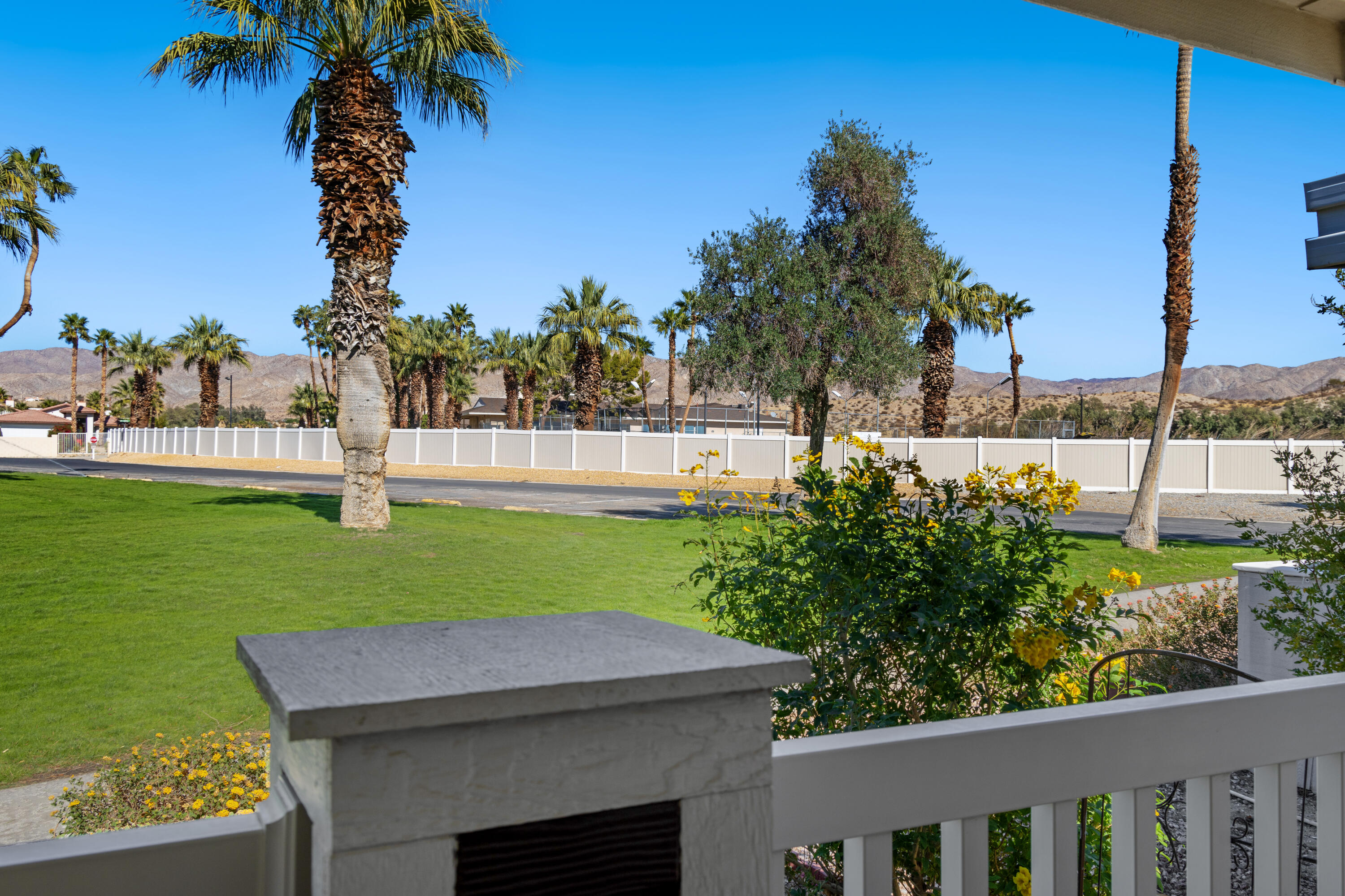 15500 Bubbling Wells Road, Unit 243 Desert Hot Springs, CA 92240 - Photo 21 of 39 a view of an house with backyard space and garden
