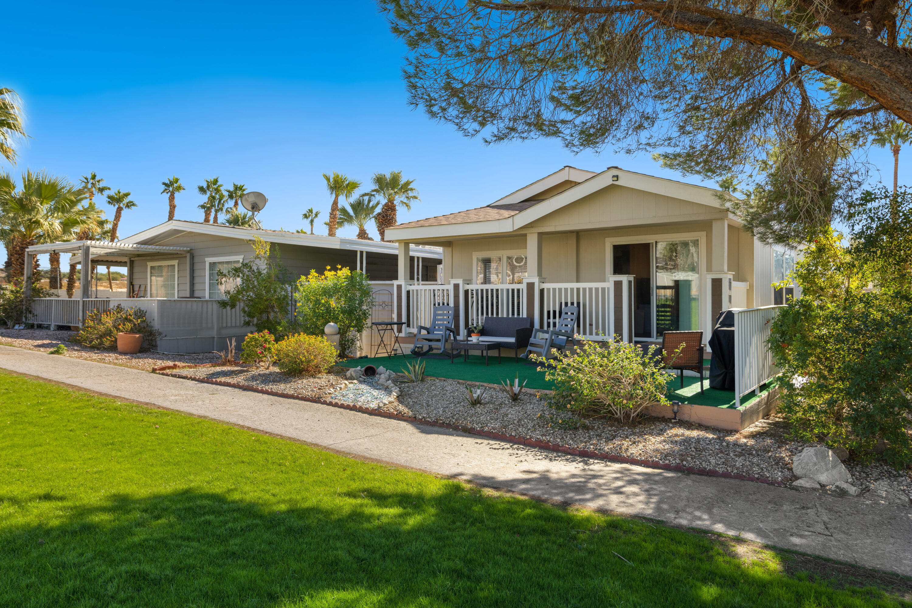 15500 Bubbling Wells Road, Unit 243 Desert Hot Springs, CA 92240 - Photo 22 of 39 a view of a house with a garden