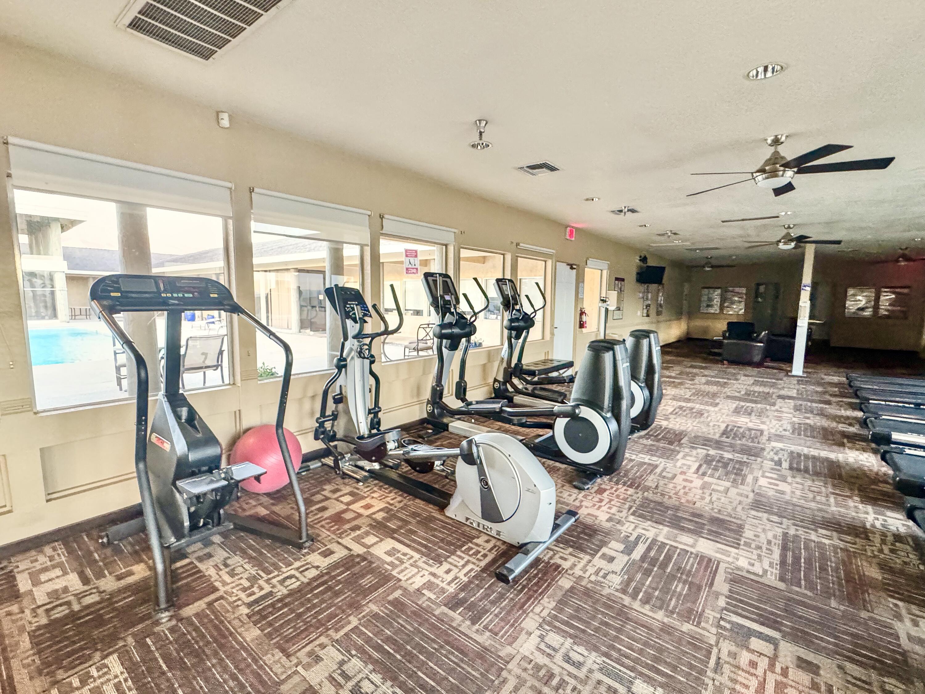 15500 Bubbling Wells Road, Unit 243 Desert Hot Springs, CA 92240 - Photo 35 of 39 a view of a room with gym equipment