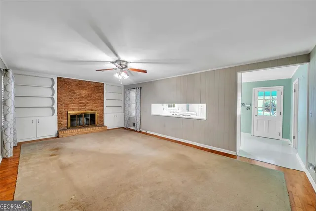 en view interior of a house a ceiling fan and windows