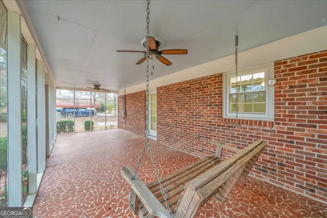 a view of an empty room and a window