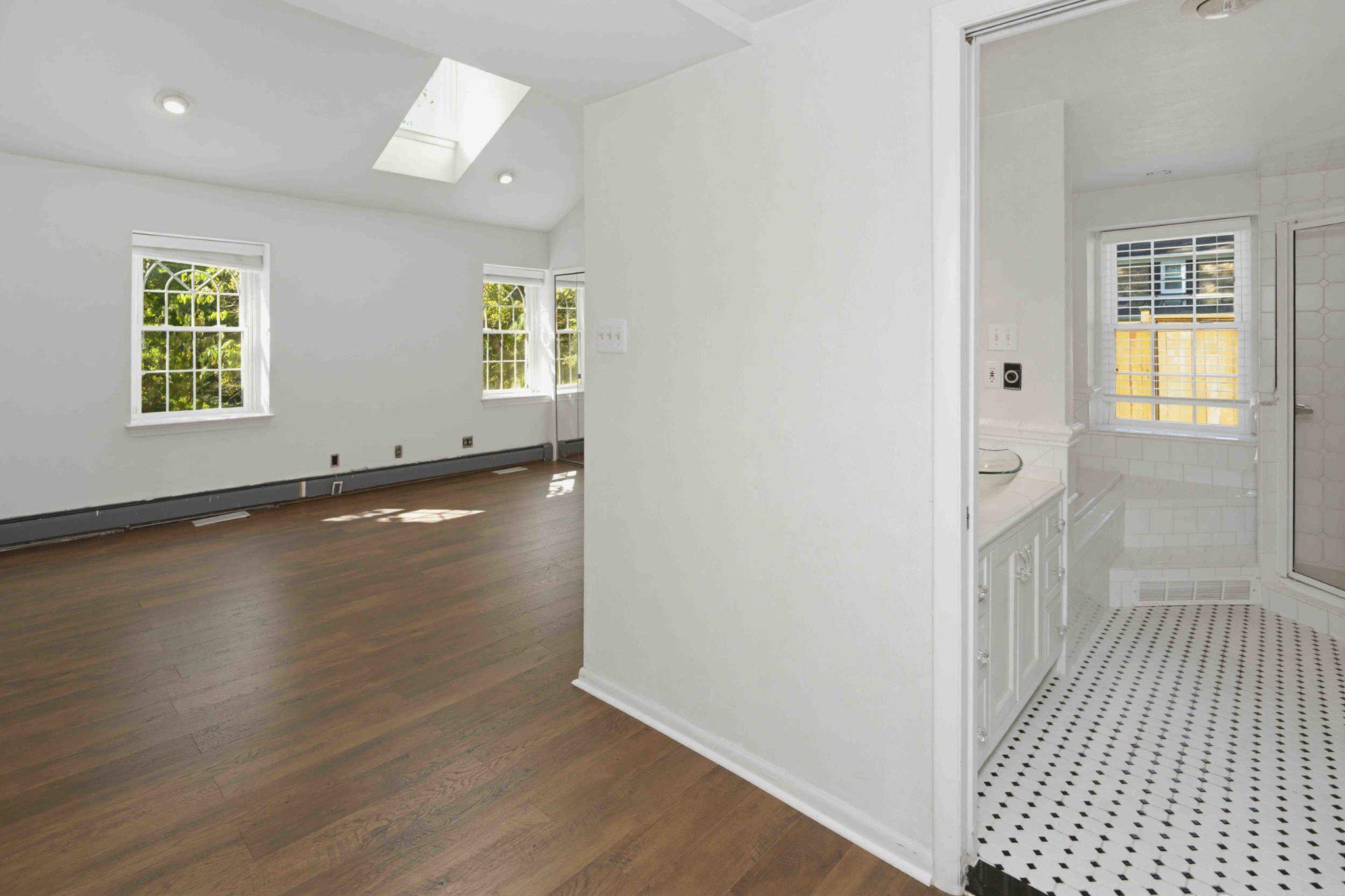 1268 Rydal Road Jenkintown, PA 19046 - Photo 22 of 31 an empty room with wooden floor and windows