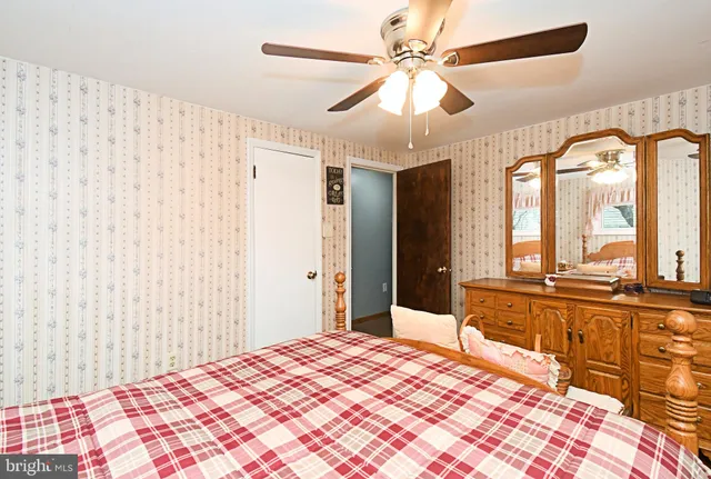 a bedroom with bed and a window