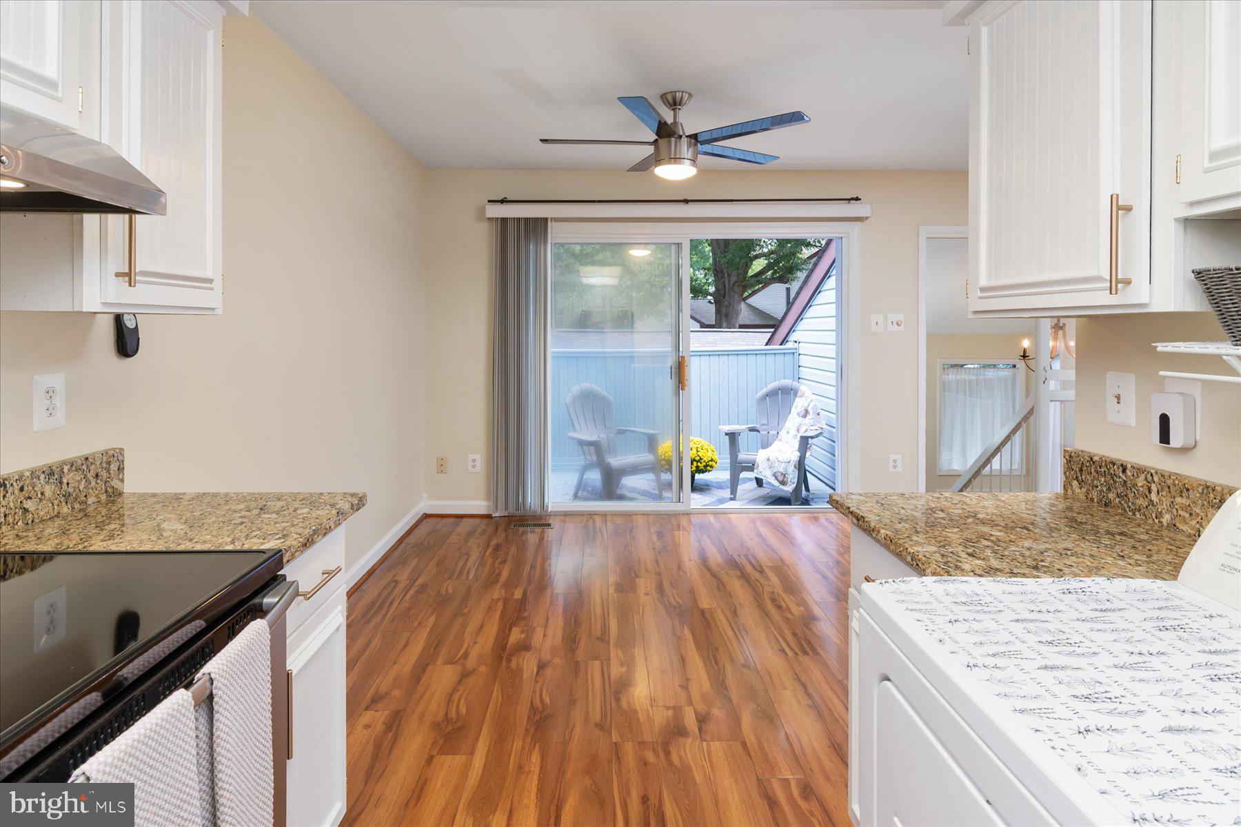 1914 Ardenwood Terrace Crofton, MD 21114 - Photo 11 of 34 a kitchen with granite countertop a oven a counter space and a sink