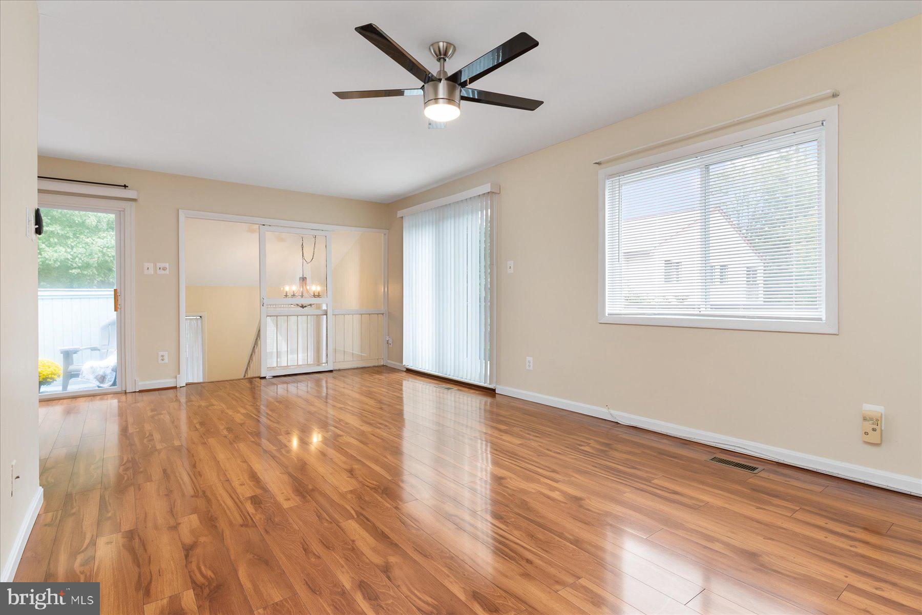 1914 Ardenwood Terrace Crofton, MD 21114 - Photo 18 of 34 an empty room with wooden floor and windows