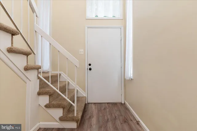 a view of entryway with wooden floor
