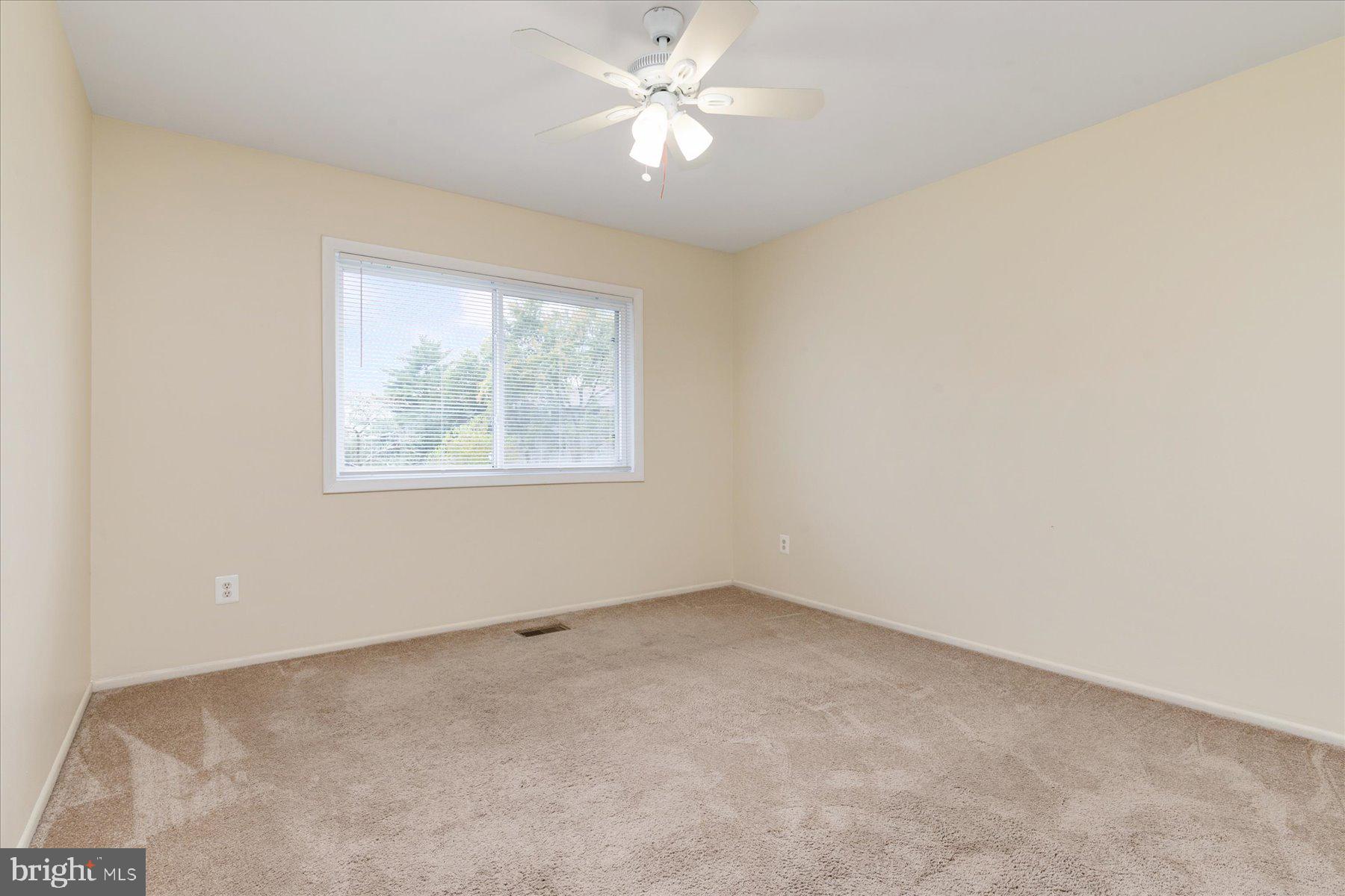 1914 Ardenwood Terrace Crofton, MD 21114 - Photo 21 of 34 an empty room with a window and a fan