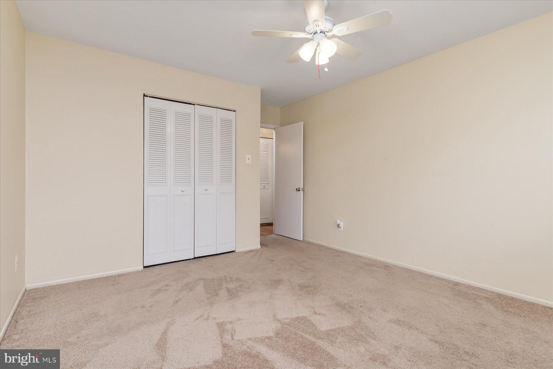 1914 Ardenwood Terrace Crofton, MD 21114 - Photo 22 of 34 an empty room with a ceiling fan and a window