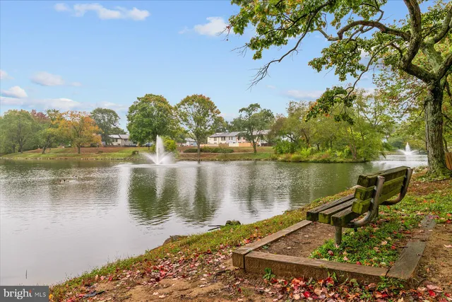 a view of a lake with a house in the background
