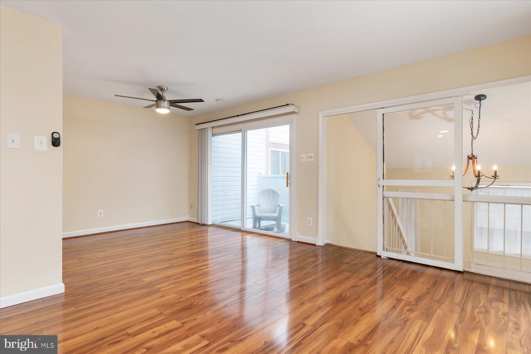 1914 Ardenwood Terrace Crofton, MD 21114 - Photo 6 of 34 a view of an empty room with wooden floor and a window