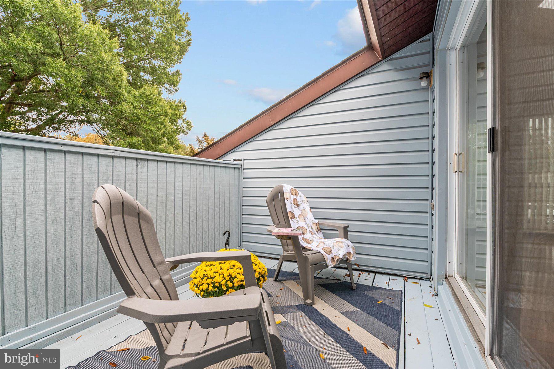 1914 Ardenwood Terrace Crofton, MD 21114 - Photo 9 of 34 a view of a balcony with two chairs and a table