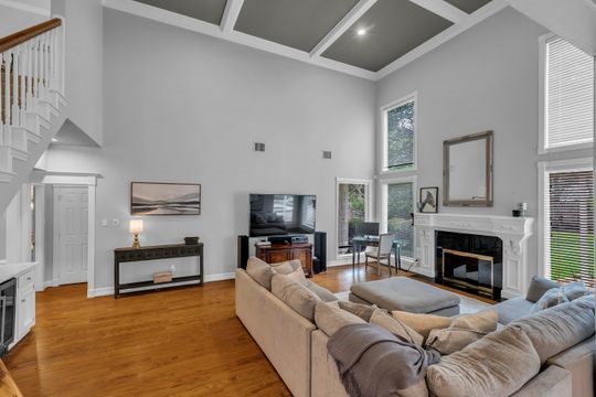 8723 Kennet Valley Road Spring, TX 77379 - Photo 12 of 38 a living room with furniture a fireplace and a flat screen tv