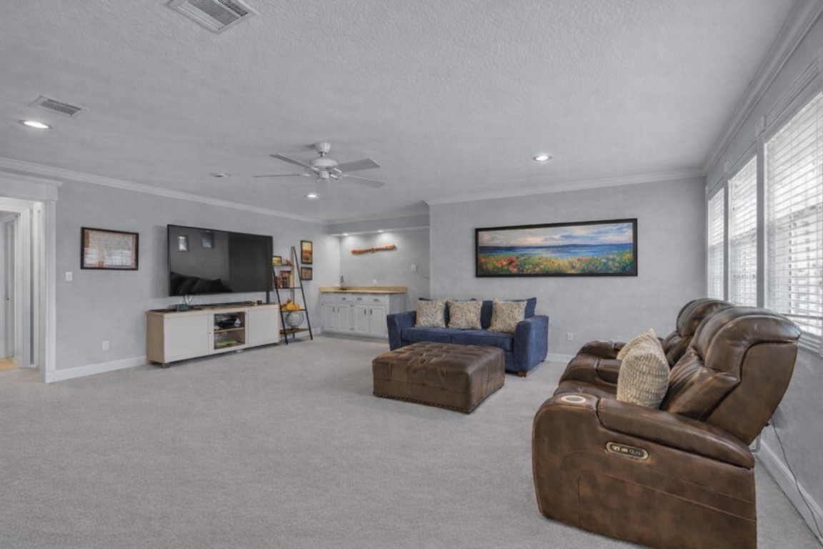 8723 Kennet Valley Road Spring, TX 77379 - Photo 21 of 38 a living room with furniture and a flat screen tv