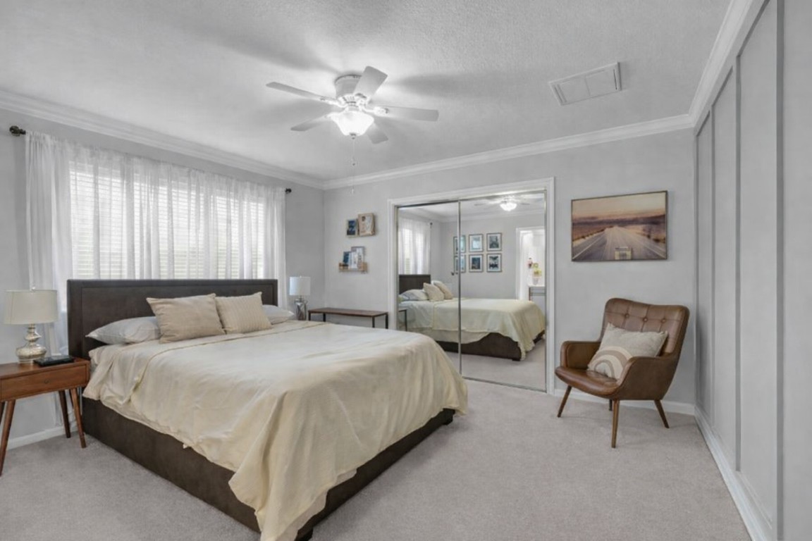 8723 Kennet Valley Road Spring, TX 77379 - Photo 22 of 38 a bedroom with a bed and a chandelier