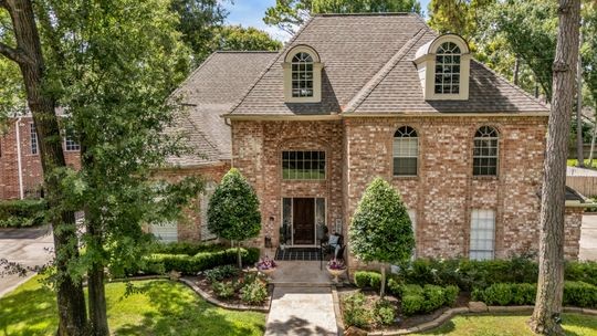 8723 Kennet Valley Road Spring, TX 77379 - Photo 34 of 38 front view of a house with a yard