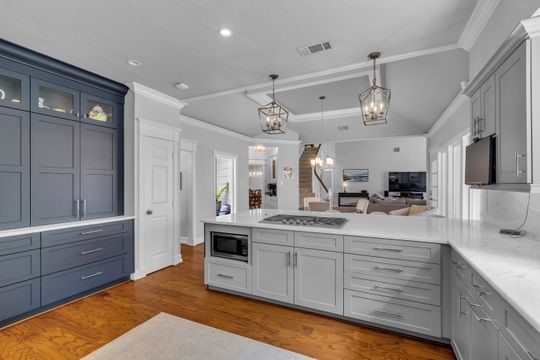 8723 Kennet Valley Road Spring, TX 77379 - Photo 9 of 38 a kitchen with stainless steel appliances kitchen island granite countertop a sink and cabinets