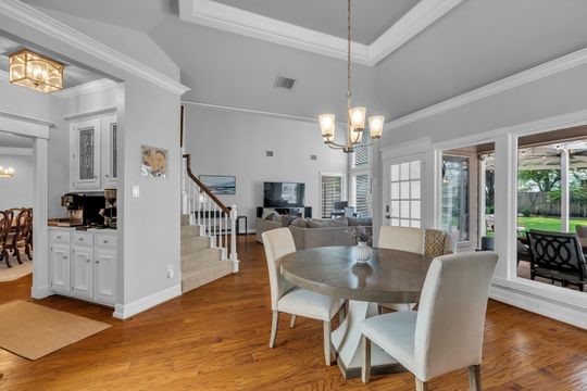 8723 Kennet Valley Road Spring, TX 77379 - Photo 10 of 38 a view of a dining room with furniture and wooden floor