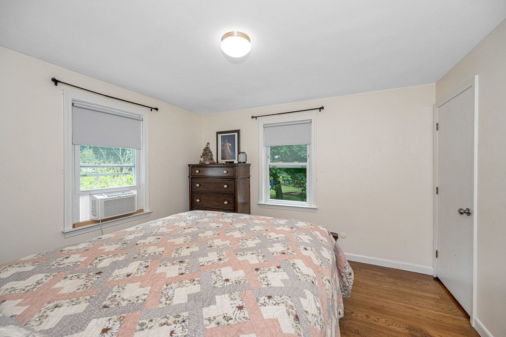 11 Cedar Circle Methuen, MA 01844 - Photo 13 of 38 a view of empty room with window and wooden floor