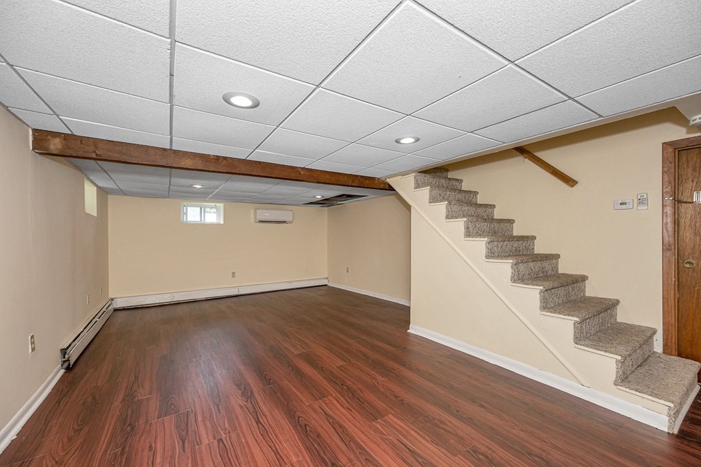 11 Cedar Circle Methuen, MA 01844 - Photo 17 of 38 a view of an empty room with wooden floor