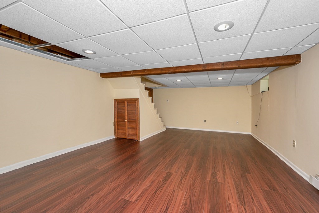 11 Cedar Circle Methuen, MA 01844 - Photo 19 of 38 a view of a room with wooden floors and white walls