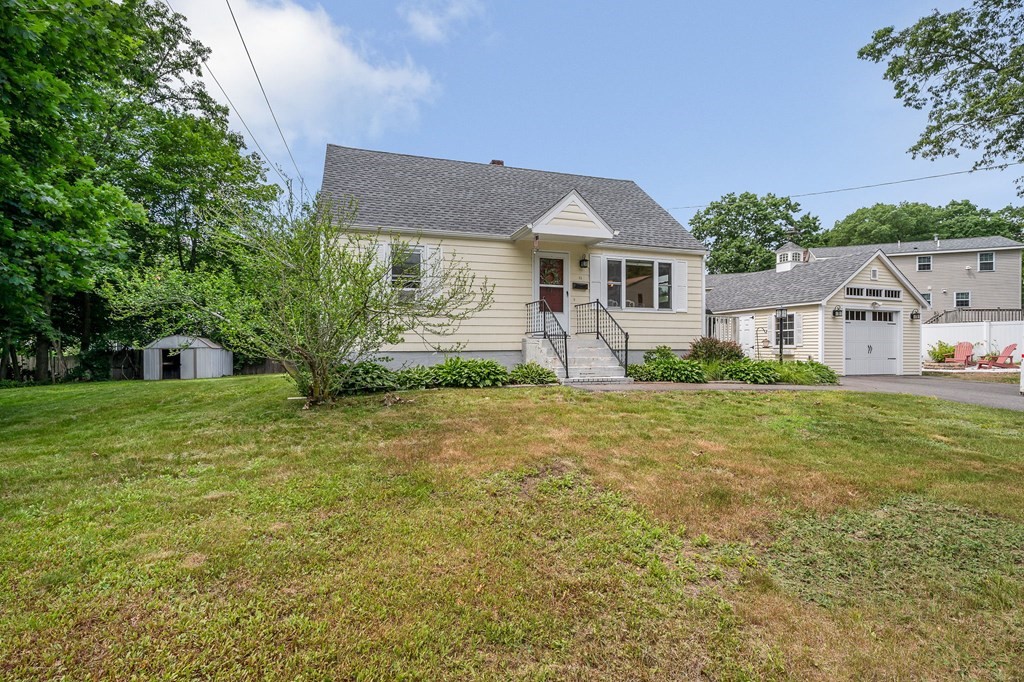 11 Cedar Circle Methuen, MA 01844 - Photo 20 of 38 a front view of a house with garden
