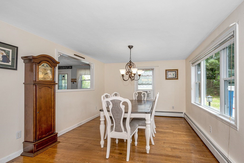 11 Cedar Circle Methuen, MA 01844 - Photo 2 of 38 a dining room with furniture a livingroom view and wooden floor