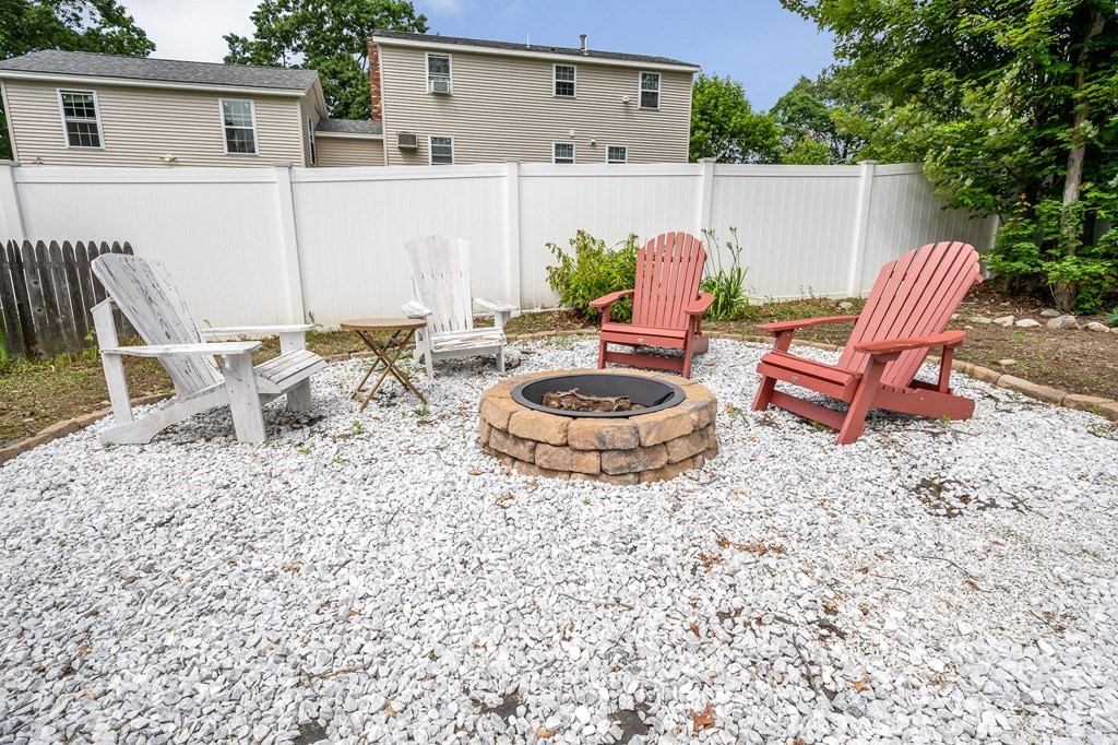 11 Cedar Circle Methuen, MA 01844 - Photo 22 of 38 a backyard of a house with table and chairs