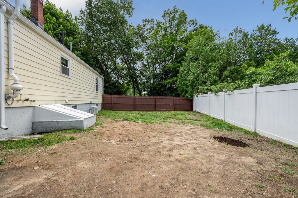 11 Cedar Circle Methuen, MA 01844 - Photo 25 of 38 a view of a backyard with a plants and trees