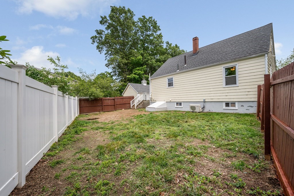 11 Cedar Circle Methuen, MA 01844 - Photo 27 of 38 a view of a backyard with large trees and plants