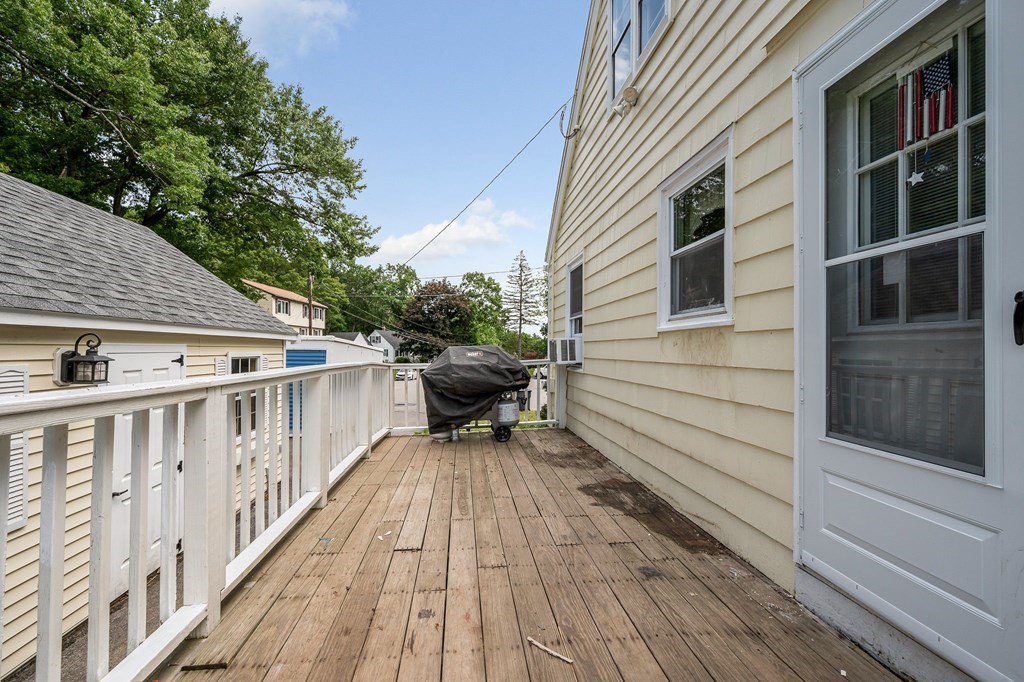 11 Cedar Circle Methuen, MA 01844 - Photo 29 of 38 a balcony of a house with wooden floor outdoor seating and yard in the back