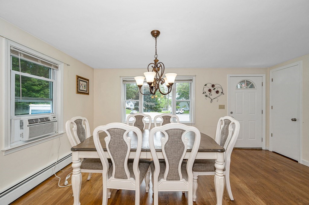 11 Cedar Circle Methuen, MA 01844 - Photo 5 of 38 a dining room with furniture a chandelier and wooden floor