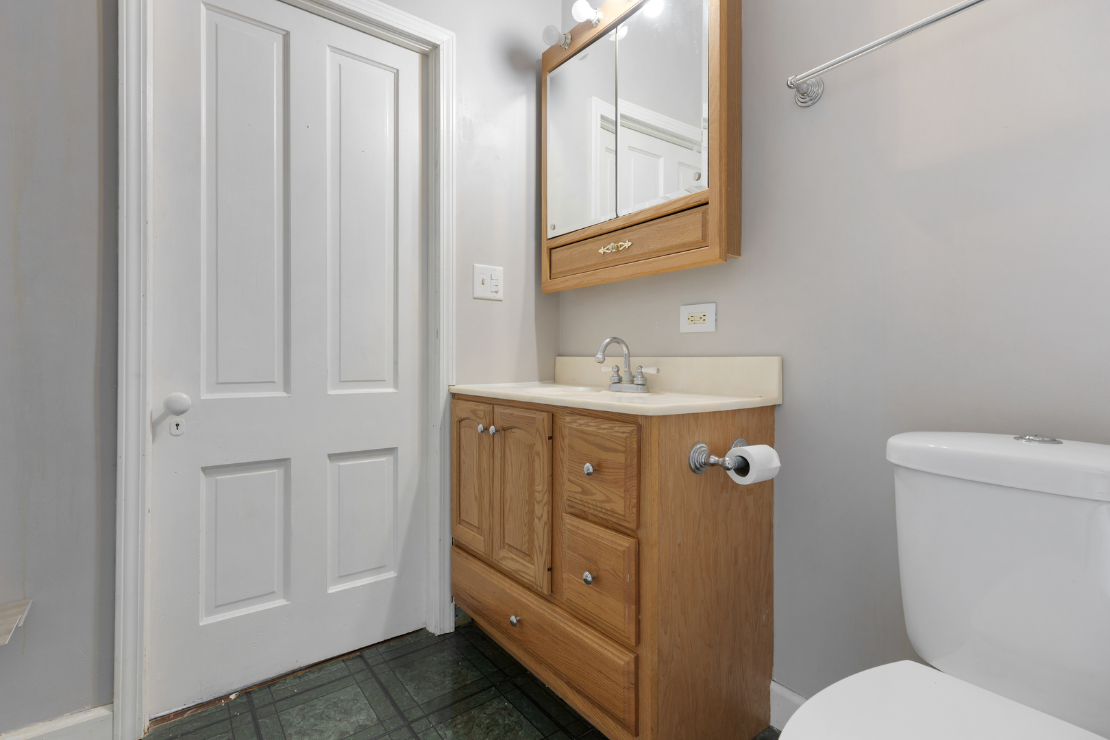 436 West Washington Street Marengo, IL 60152 - Photo 13 of 20 a bathroom with a sink a toilet and mirror