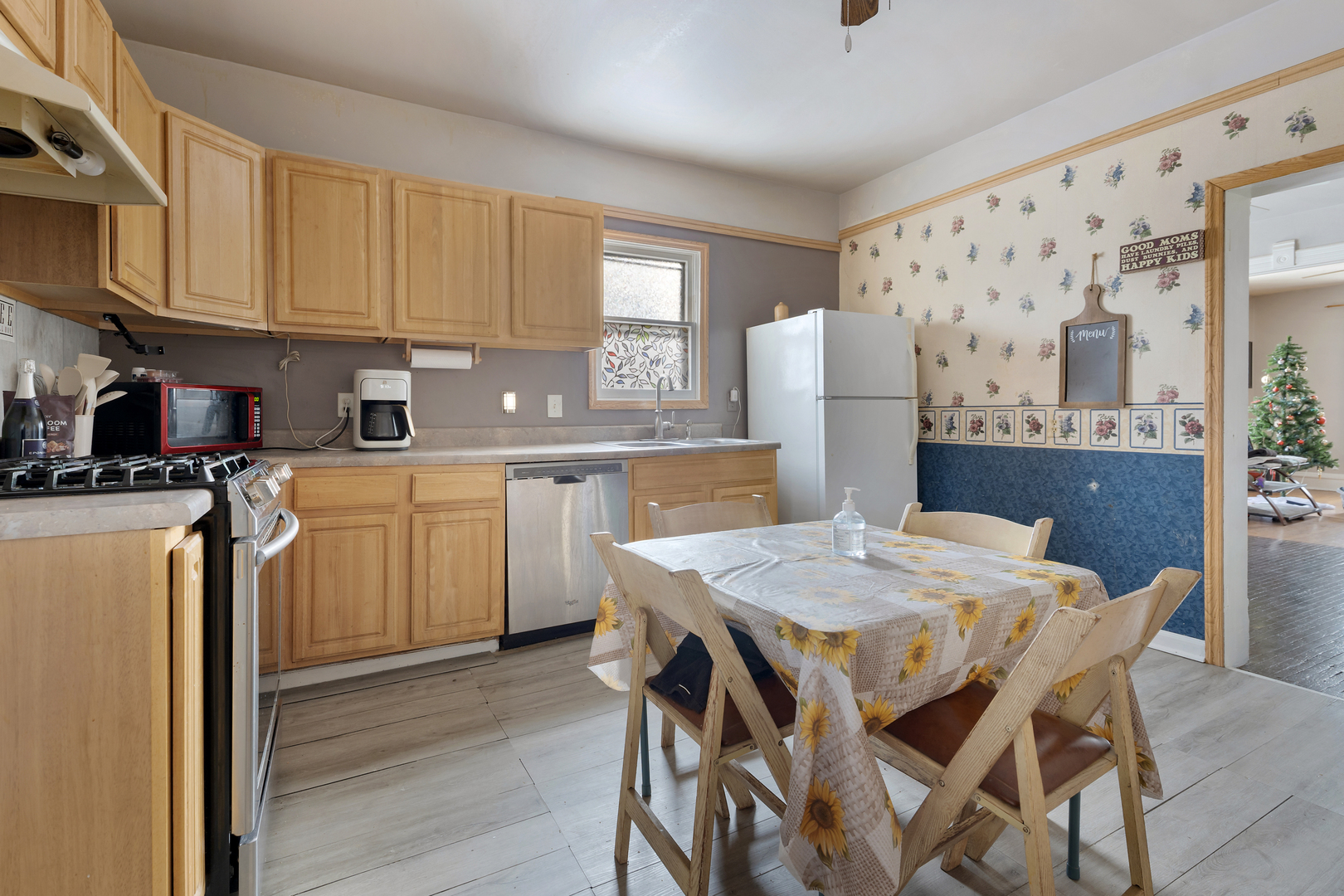 436 West Washington Street Marengo, IL 60152 - Photo 8 of 20 a kitchen with a table chairs refrigerator and cabinets