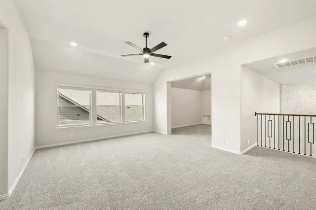 en empty room with fan and windows