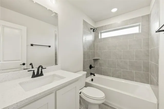 a bathroom with a sink a toilet and a bathtub