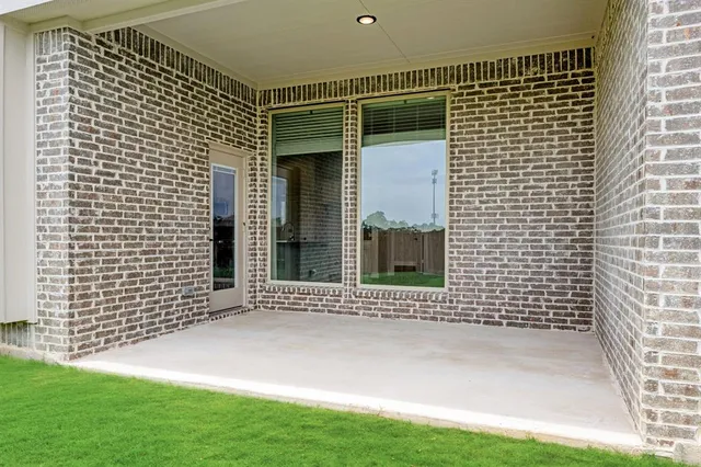 a view of a door with a wooden fence