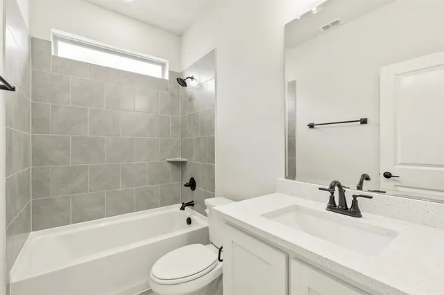 a bathroom with a sink a toilet and a bathtub