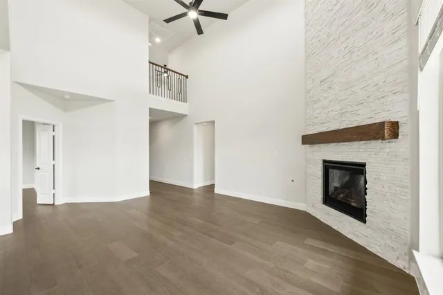 a view of an empty room with a fireplace