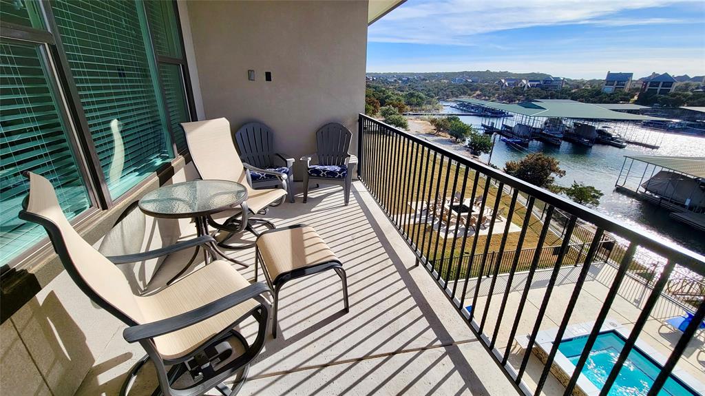 3412 Scenic Point Road, Unit 305 Graford, TX 76449 - Photo 16 of 37 a view of a balcony with chairs