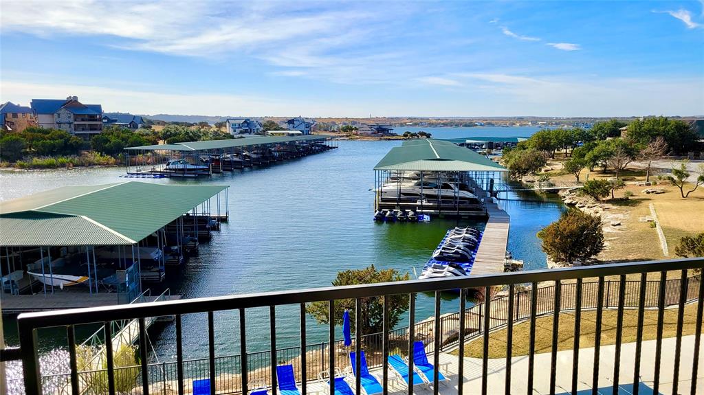3412 Scenic Point Road, Unit 305 Graford, TX 76449 - Photo 17 of 37 a view of a lake from a balcony
