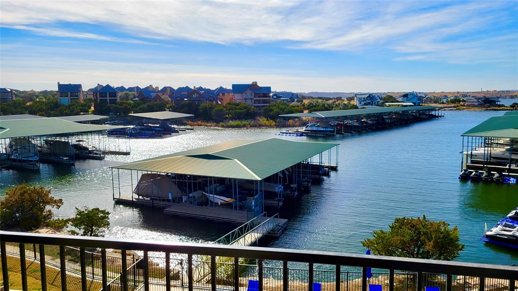 3412 Scenic Point Road, Unit 305 Graford, TX 76449 - Photo 18 of 37 a view of a lake with sitting area