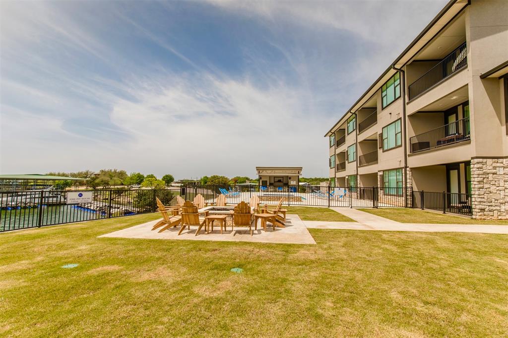 3412 Scenic Point Road, Unit 305 Graford, TX 76449 - Photo 27 of 37 a view of a swimming pool with an ocean view